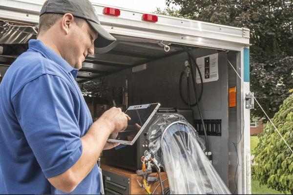 Air duct cleaning technician working on HVAC ductwork in Dallas Texas home
